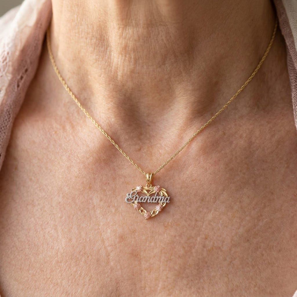 [group: 10k-gold] Gold necklace with a heart-shaped pendant on a person's neck