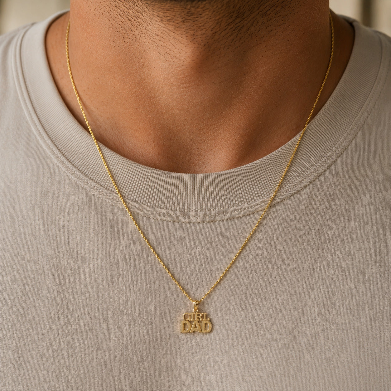 Gold Girl Dad Pendant worn by female model 
